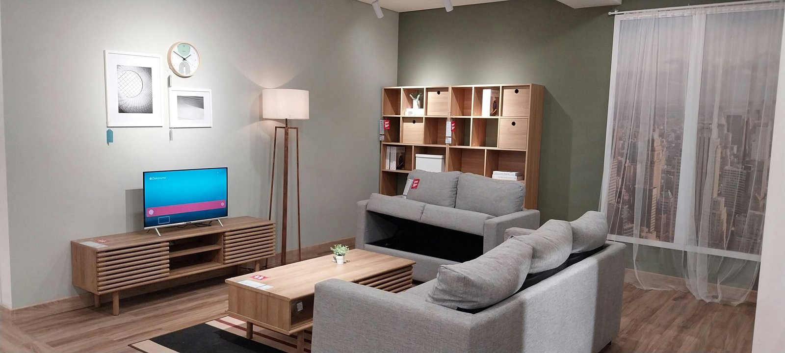 a living room filled with furniture and a flat screen tv
