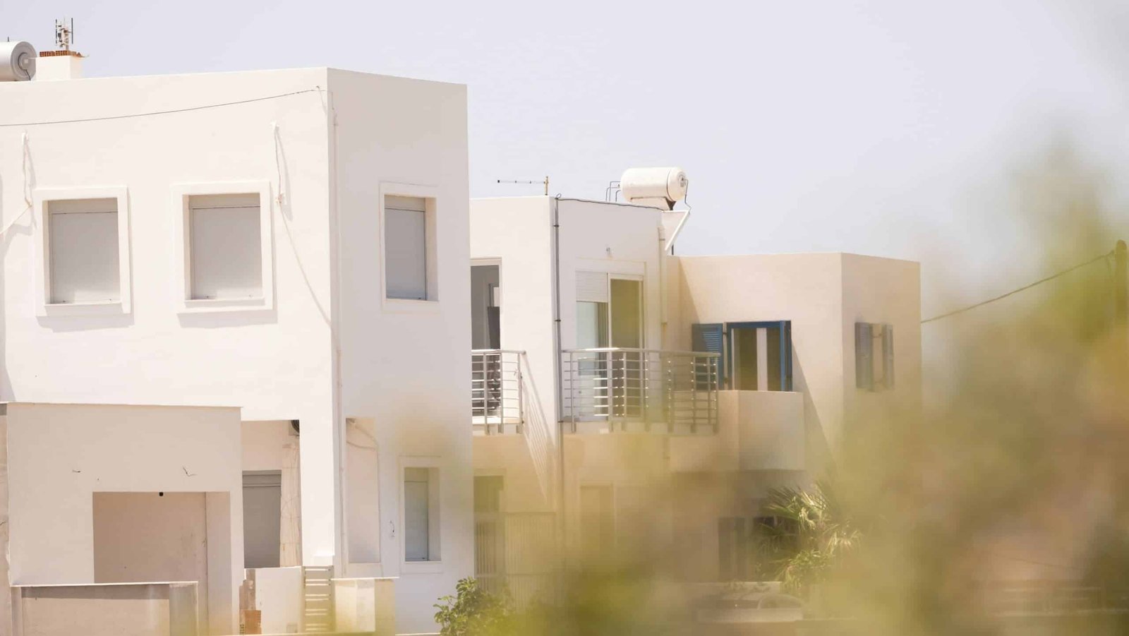 a white building with balconies and balconies on top of it