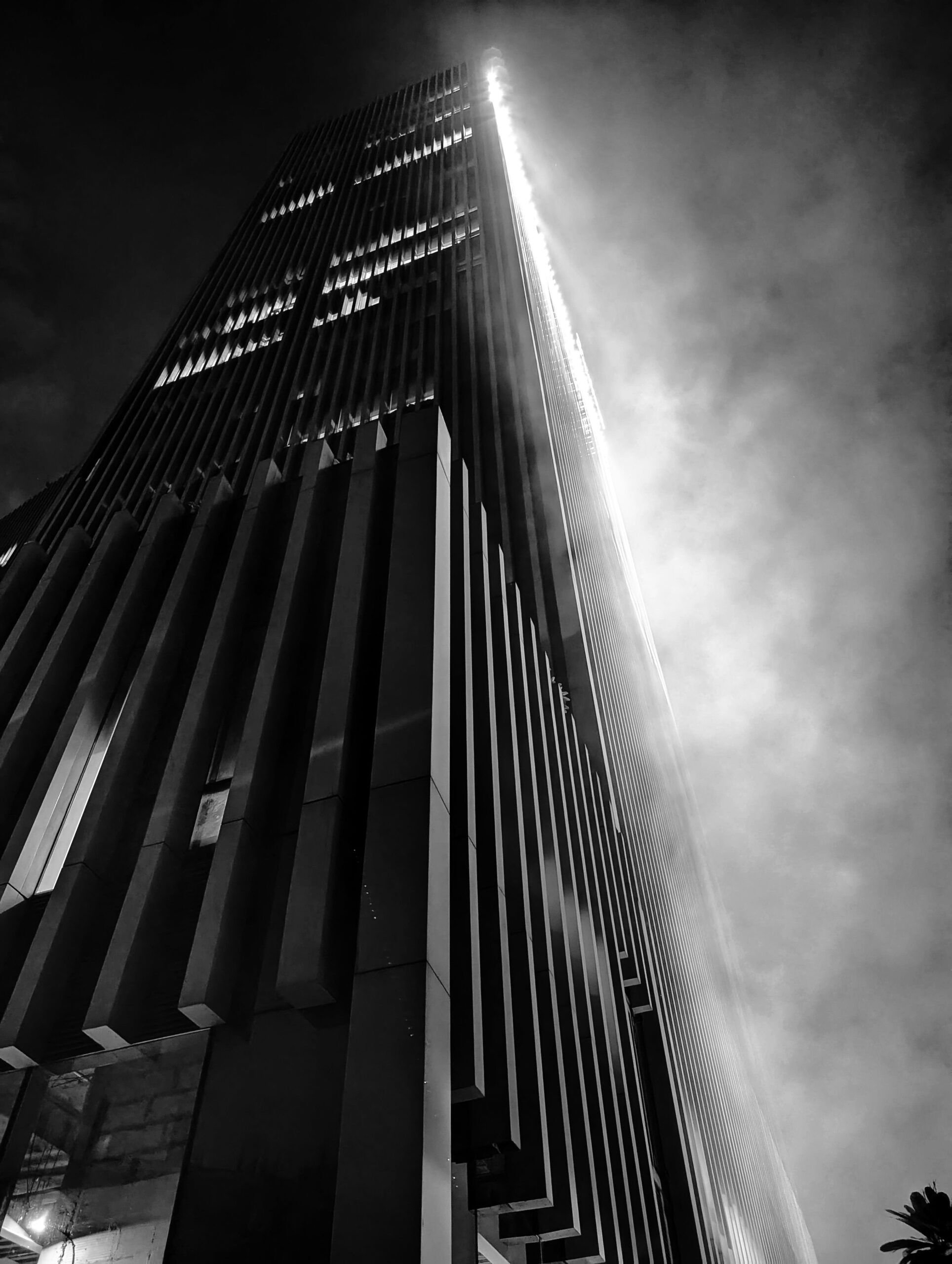 A black and white photo of a tall building